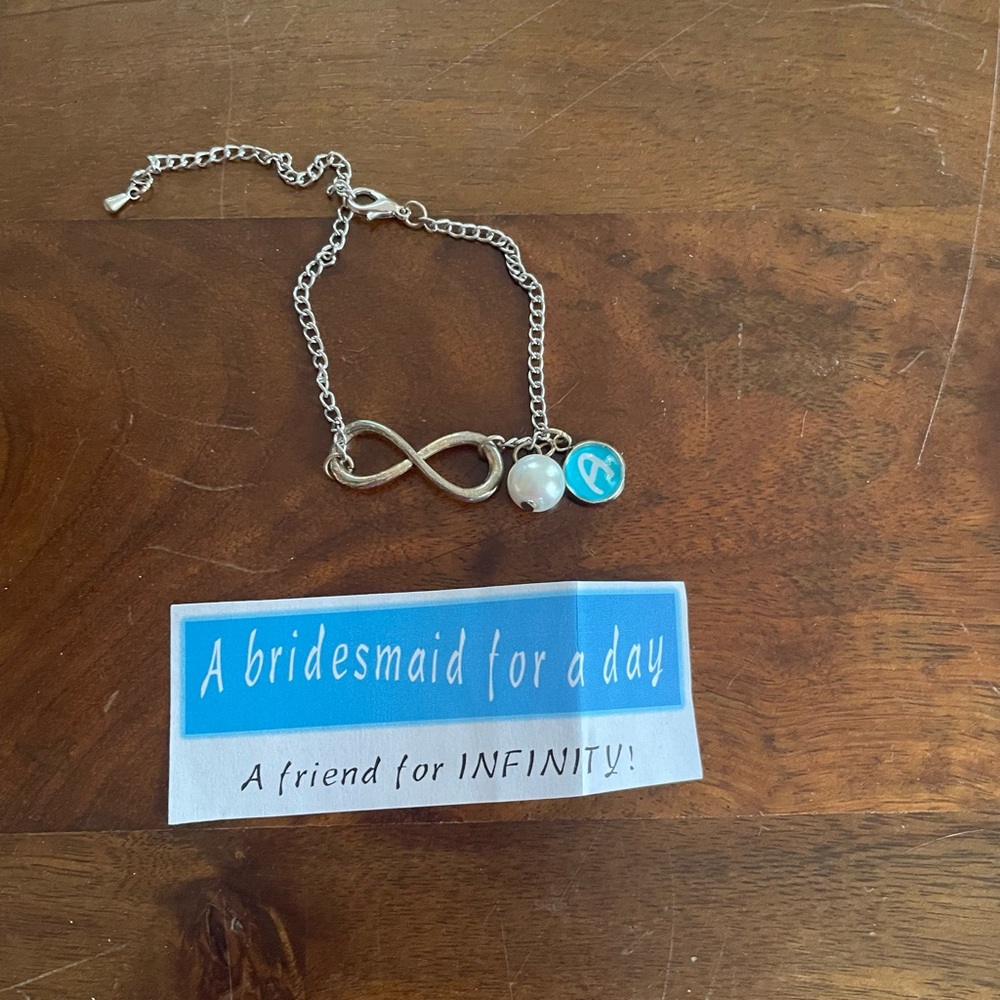 Silver Infinity Bracelet with Pearl and Blue “A” Charm